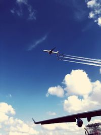 Low angle view of airplane flying in sky