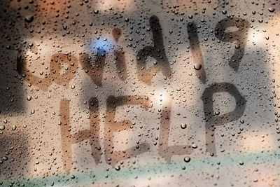 Full frame shot of raindrops on glass window