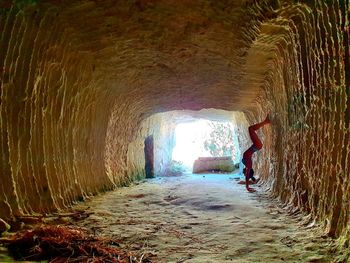 Full length of woman in tunnel