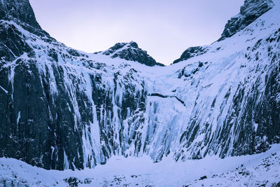 Snow covered mountains against sky