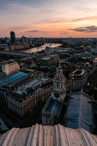 High angle view of buildings in city against sky during sunset