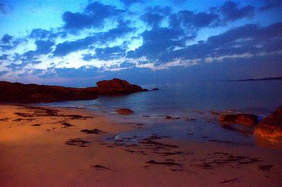 Scenic view of sea against sky at sunset