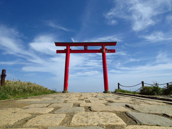 Lifeguard hut on land against sky