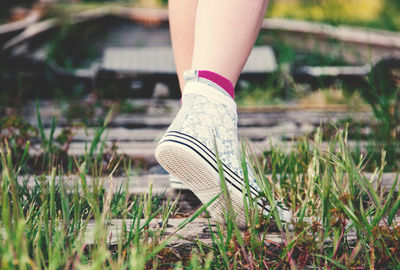 Low section of woman standing on ground