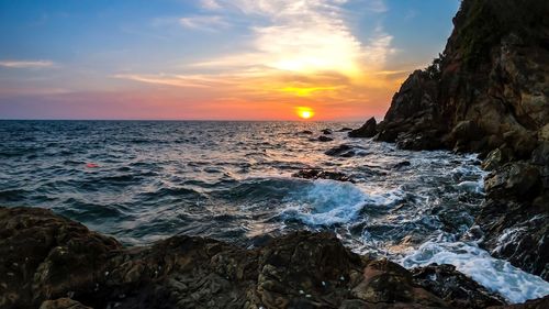 Scenic view of sea against sky during sunset