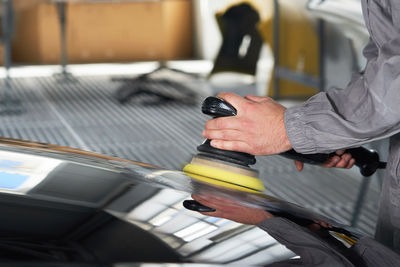 High angle view of man working on escalator