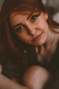 Close-up portrait of smiling young woman