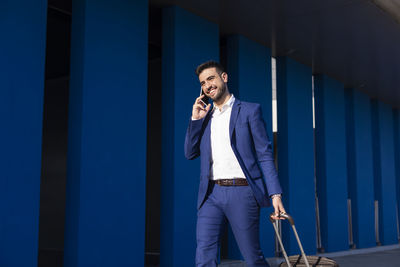 Businessman with suitcase taking a business trip