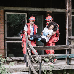 Rescue team evacuating disaster victim
