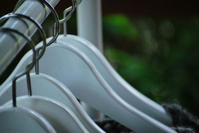 Close-up view of coathangers on rack