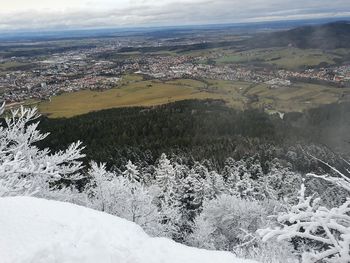 High angle view of snowcapped landscape against sky