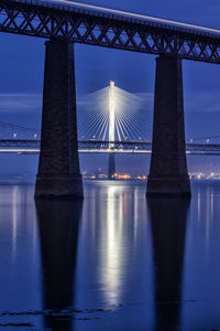 Bridges over river at night