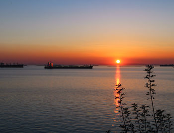 Scenic view of sea against sky during sunset