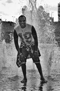 Boy standing in water