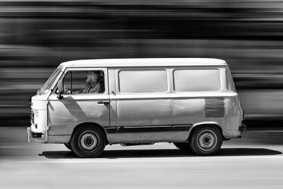 Close-up of vintage car on road