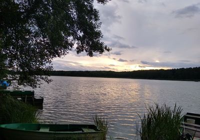 Scenic view of lake against sky during sunset