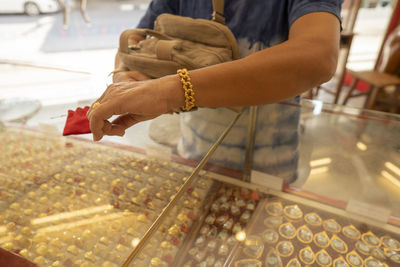 Midsection of person holding ice cream