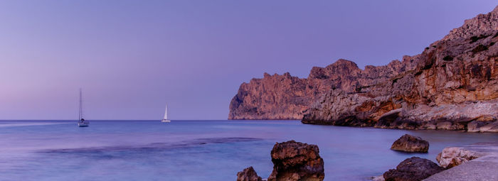 Scenic view of sea against clear blue sky