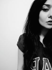 Portrait of young woman over white background