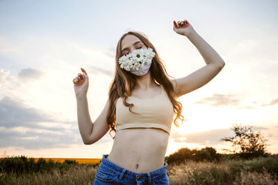 Statement masks, blinged out diy flower face mask design. girl in face mask decorated with flowers 