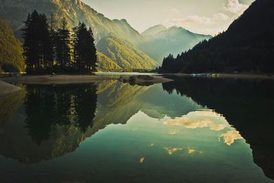 Scenic view of lake and mountains against sky