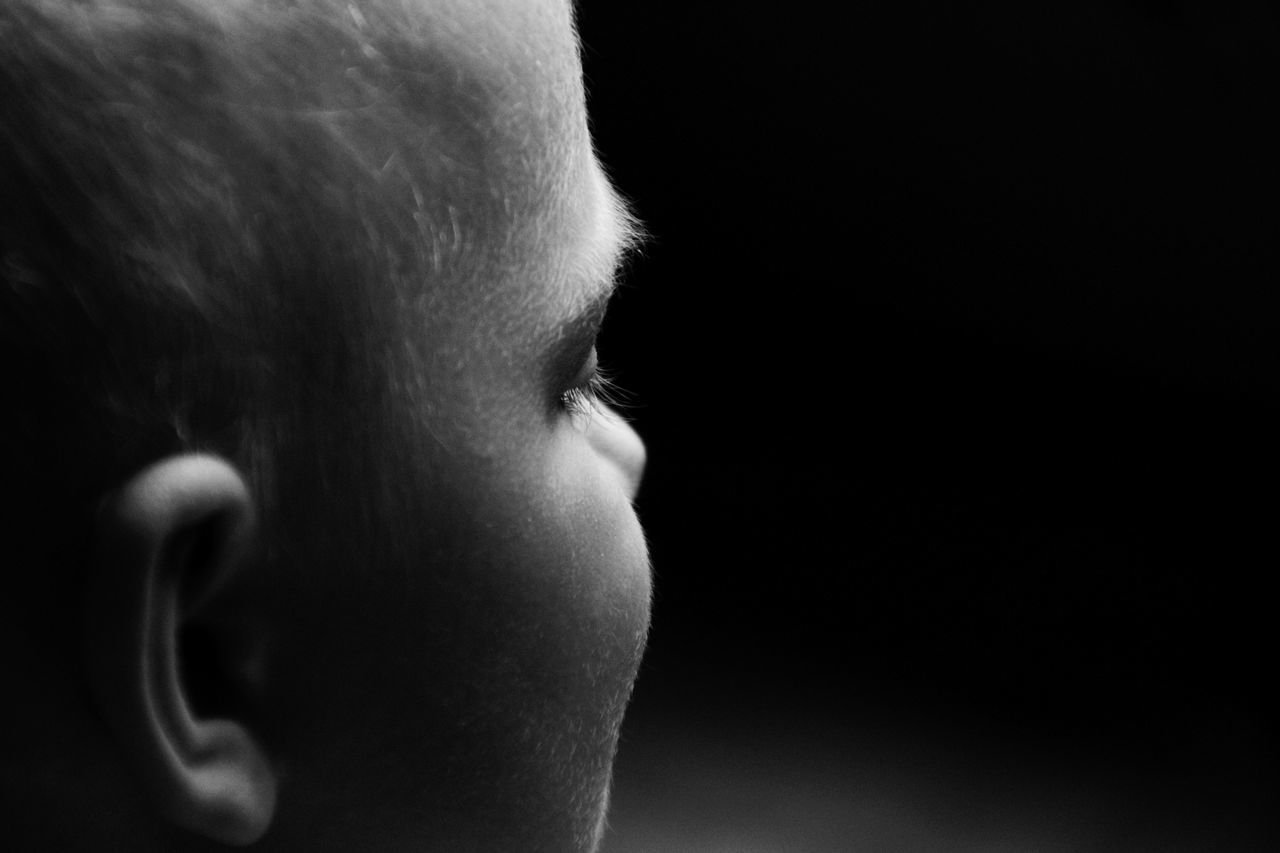 headshot, studio shot, lifestyles, close-up, young adult, contemplation, human face, person, side view, looking away, young women, serious, indoors, black background, head and shoulders, leisure activity, copy space, profile view