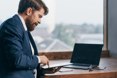 Man using laptop on table