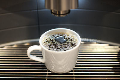 High angle view of coffee cup on table