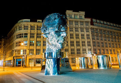 Low angle view of illuminated buildings at night