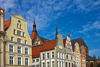 Low angle view of traditional buildings in city against sky