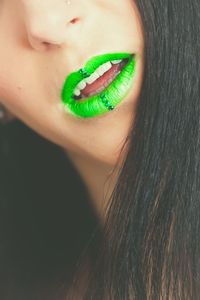 Cropped image of woman with green lipstick