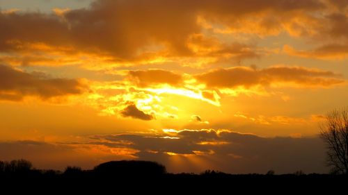 Scenic view of dramatic sky during sunset