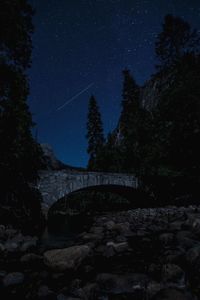 Scenic view of landscape against sky at night