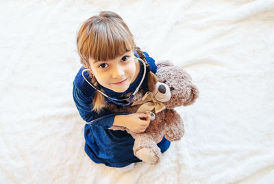 Cute girl with teddy bear