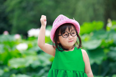 Close-up of girl wearing eyeglasses while looking away