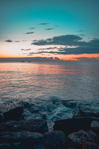 Scenic view of sea against sky during sunset