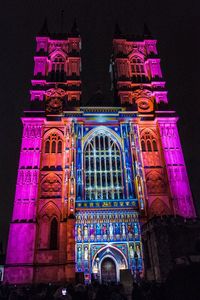 Low angle view of illuminated building at night
