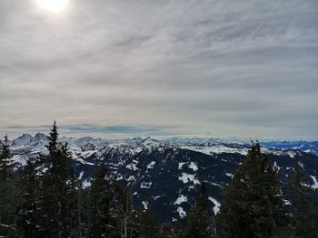 Scenic view of snowcapped mountains against sky