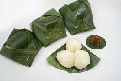 Close-up of food served on table against white background