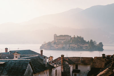 View of the san giulio island on lake orta at sunset