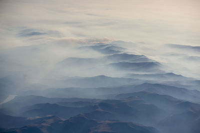 Low angle view of mountain against sky during sunset