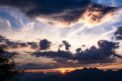 Scenic view of silhouette mountains against sky during sunset