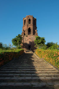 Steps of historic building against clear blue sky