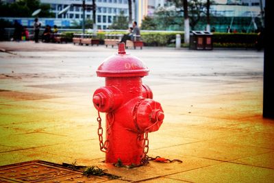 Red fire hydrant on footpath