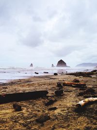 Scenic view of sea against cloudy sky