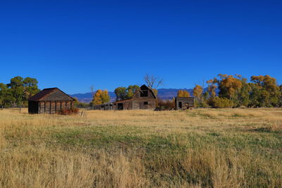Old barns in the ruby valley with deciduous trees in the background