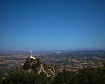 Scenic view of landscape against clear blue sky