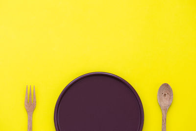 Directly above shot of yellow paint on table