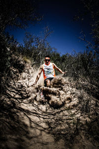 Low angle view of man against sky