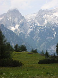 Scenic view of snowcapped mountains against sky